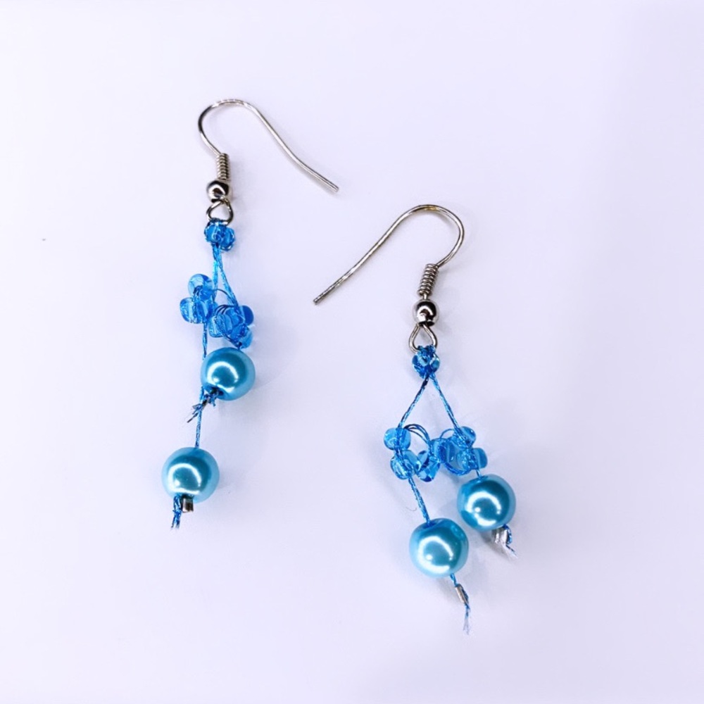 Light blue beaded dangle earrings